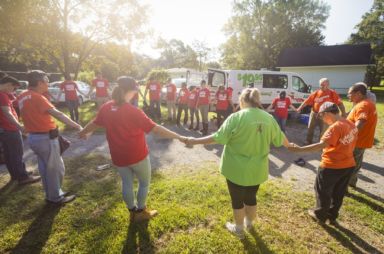 People holding hands in a circle