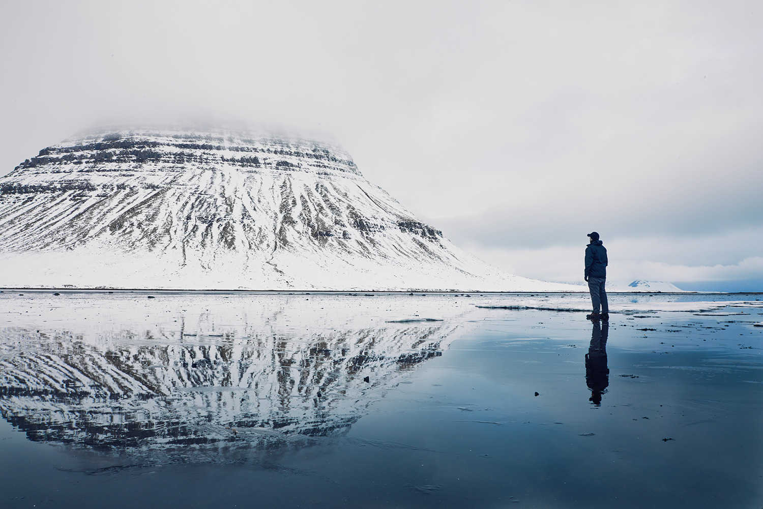 man standing snow mountain